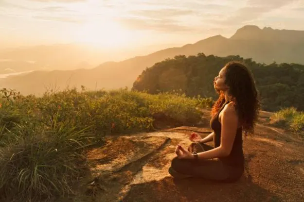 woman meditating in nature