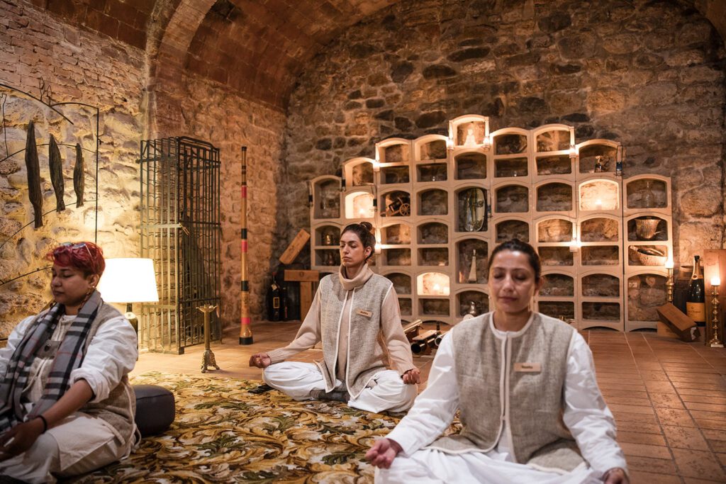 women meditating at datu