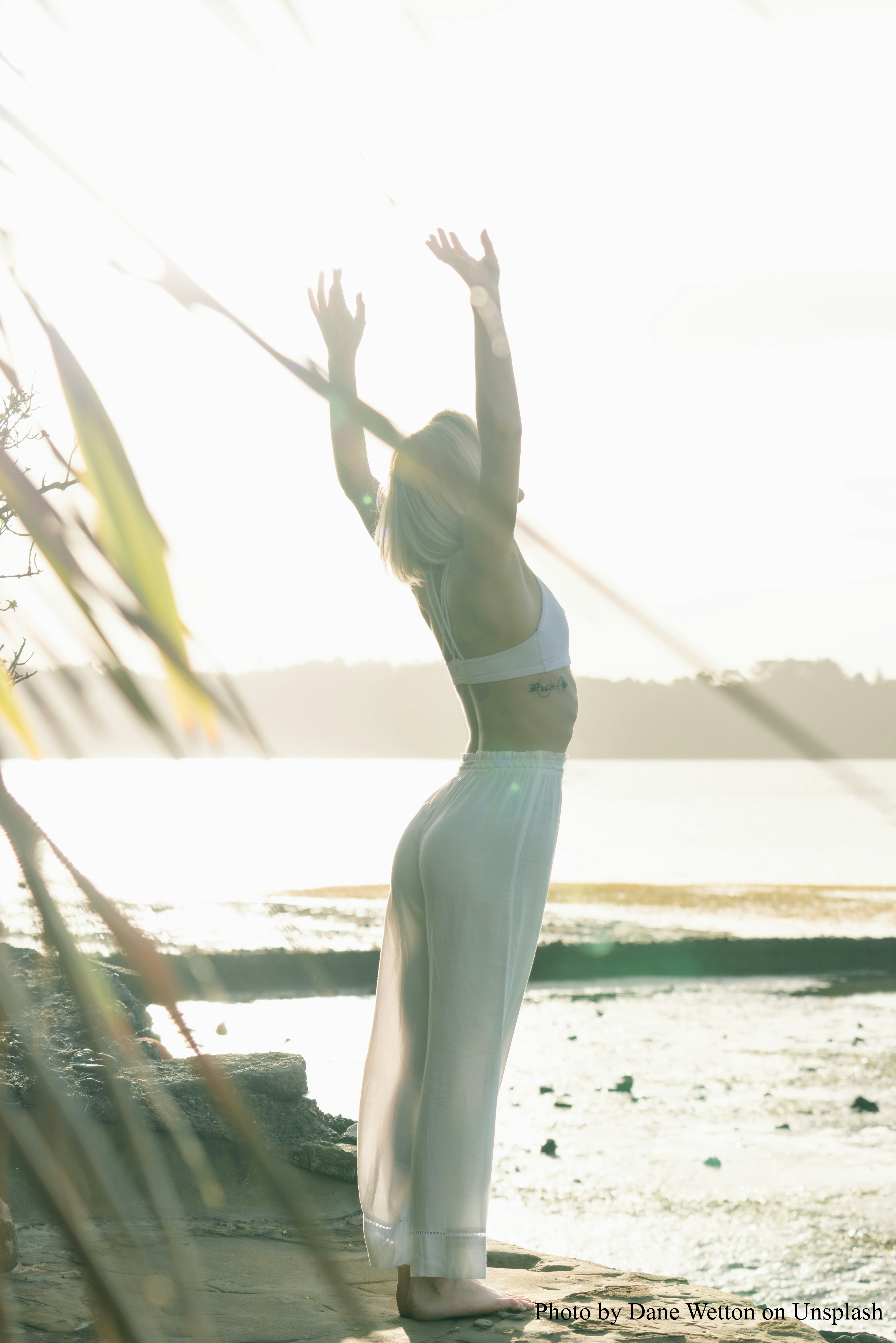 woman stretching and sunbathing