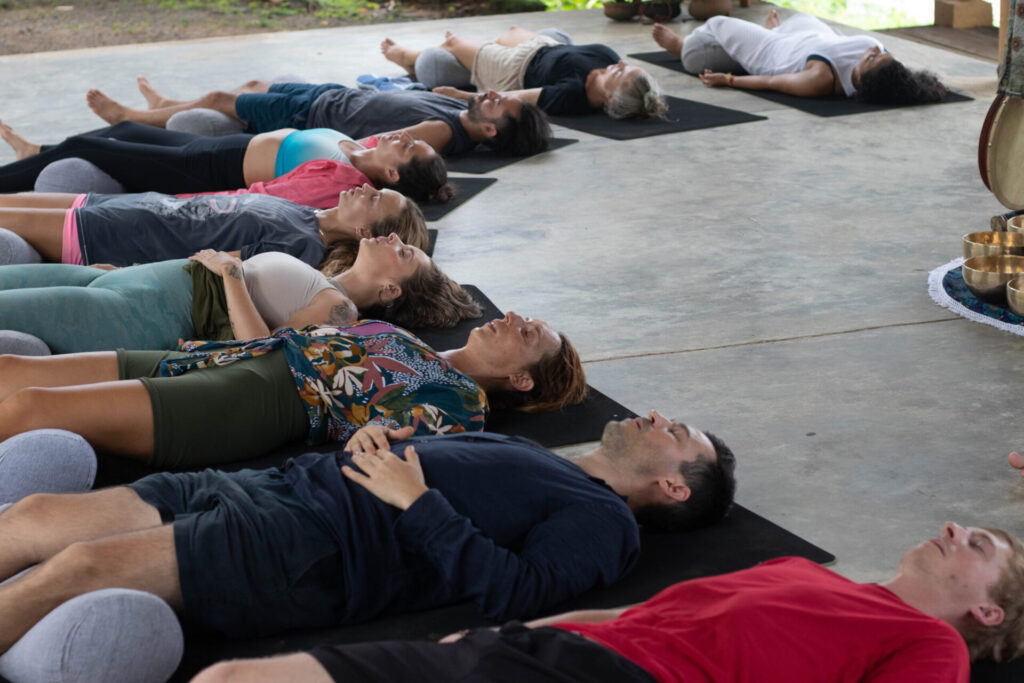 group of people doing meditation